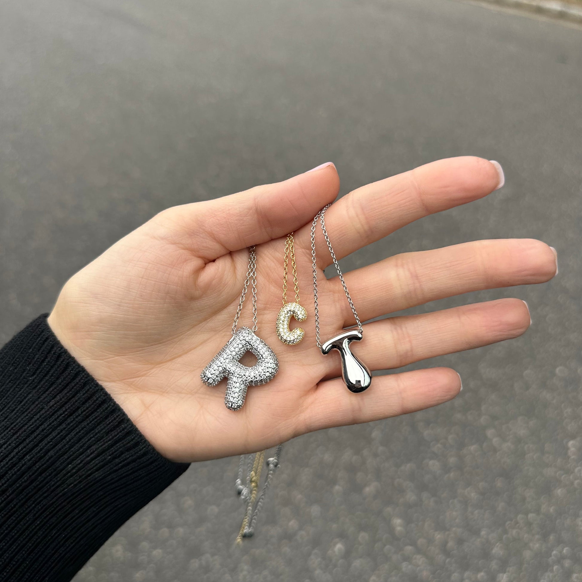 Hailey Bieber-inspired bubble letter initial necklace made from high-quality sterling silver, offering a stylish and durable way to personalize your look with a trendy and chic design. Perfect for layering or solo wear.