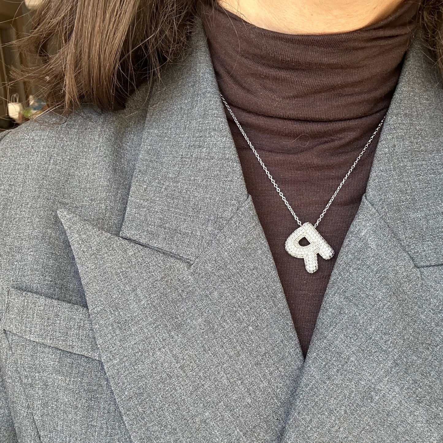 Frosted bubble letter initial necklace, inspired by Hailey Bieber, made from high-quality sterling silver for a timeless, durable, and trendy accessory. Perfect for personalized style with a chic frosted finish.