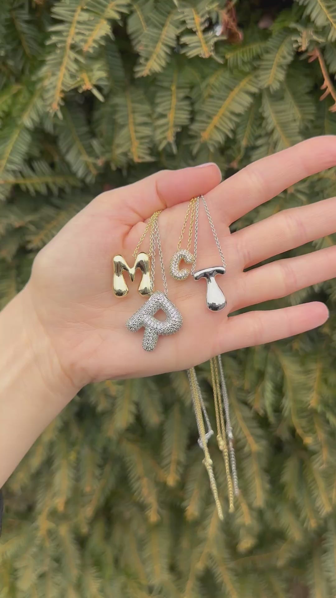 Hailey Bieber-inspired bubble letter initial necklace made from high-quality sterling silver, offering a stylish and durable way to personalize your look with a trendy and chic design. Perfect for layering or solo wear.