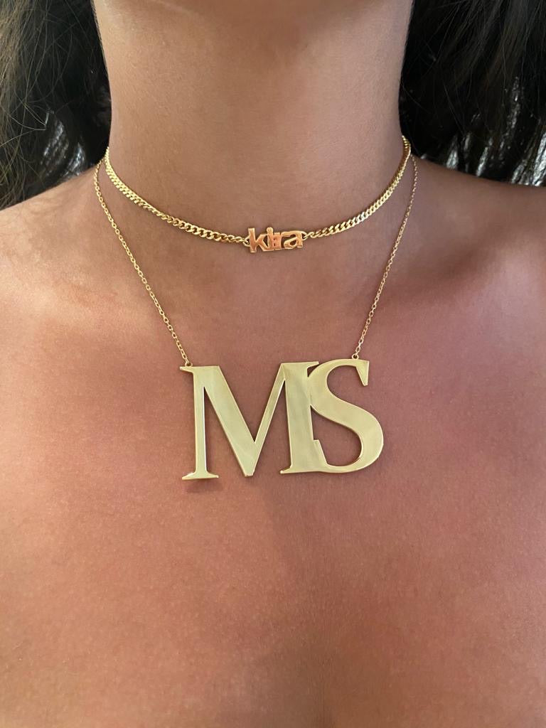 Oversized initial necklace in Times New Roman font, crafted from durable, tarnish-resistant sterling silver; personalized minimalist jewelry perfect for gifts or everyday wear.