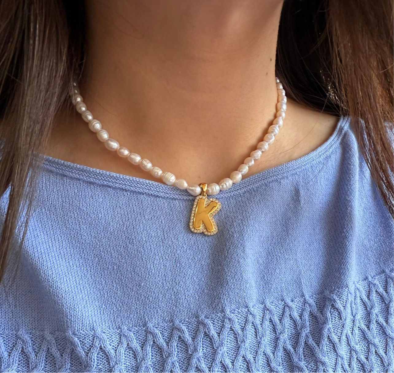 Bubble letter CZ initial necklace on a pearl strand, crafted in durable sterling silver with water-resistant, anti-tarnish finish; perfect for young girls and women who love timeless personalized jewelry
