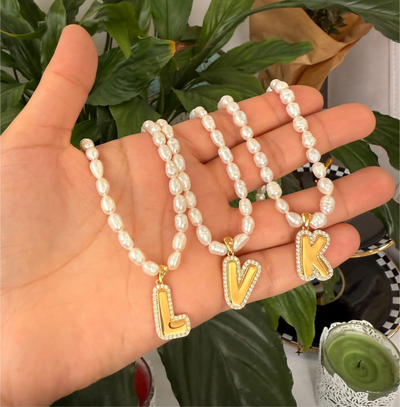 Bubble letter CZ initial necklace on a pearl strand, crafted in durable sterling silver with water-resistant, anti-tarnish finish; perfect for young girls and women who love timeless personalized jewelry